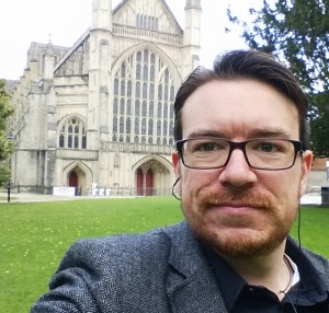 photo of the author outside Winchester cathedral